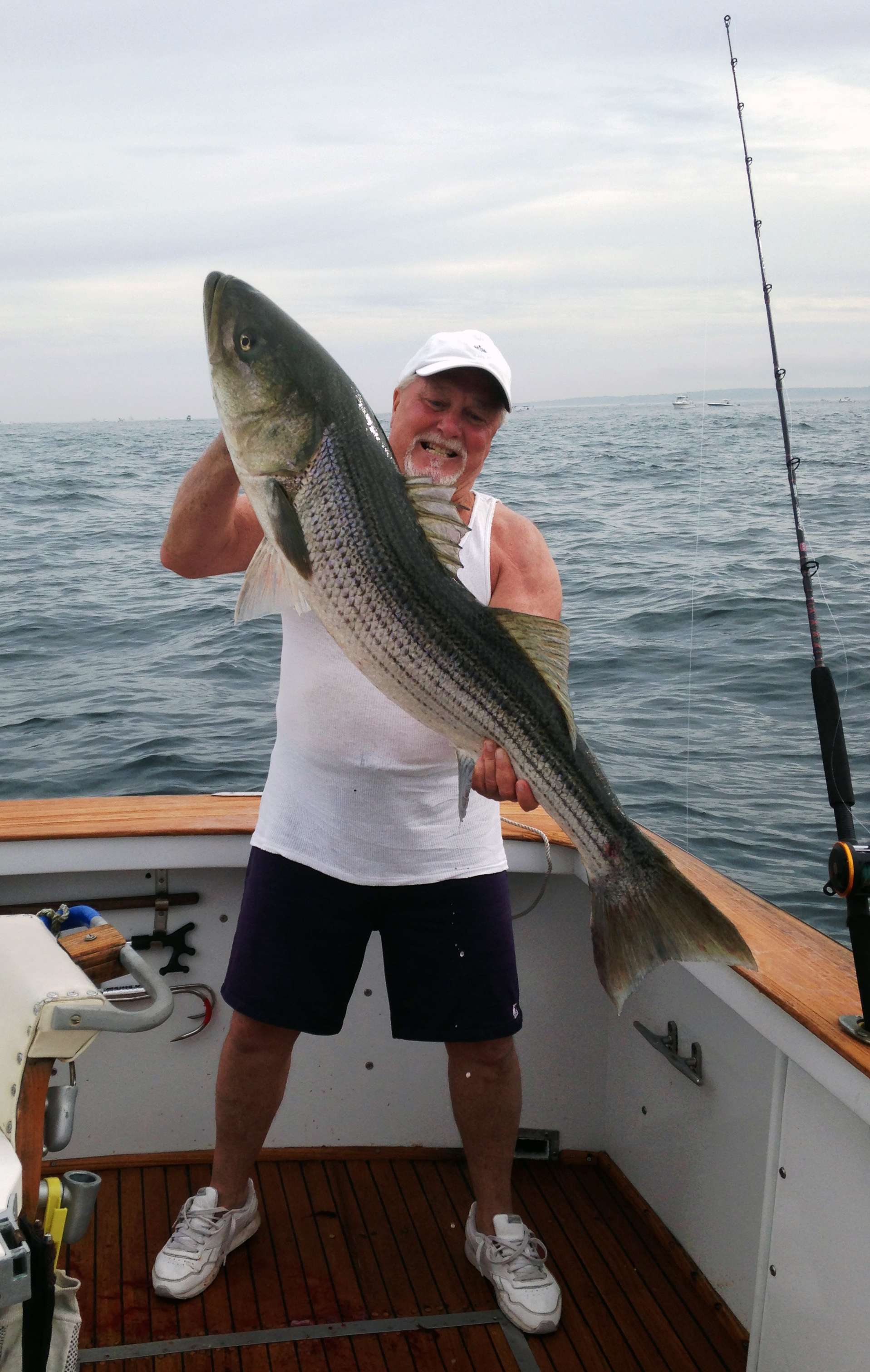 Fisherman with striped bass